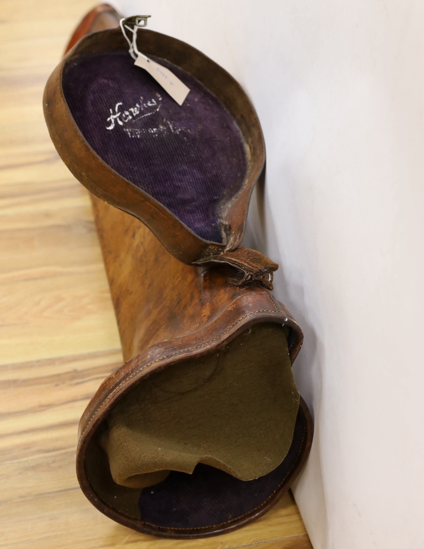 A 19th century brown leather trombone case, 103cm long